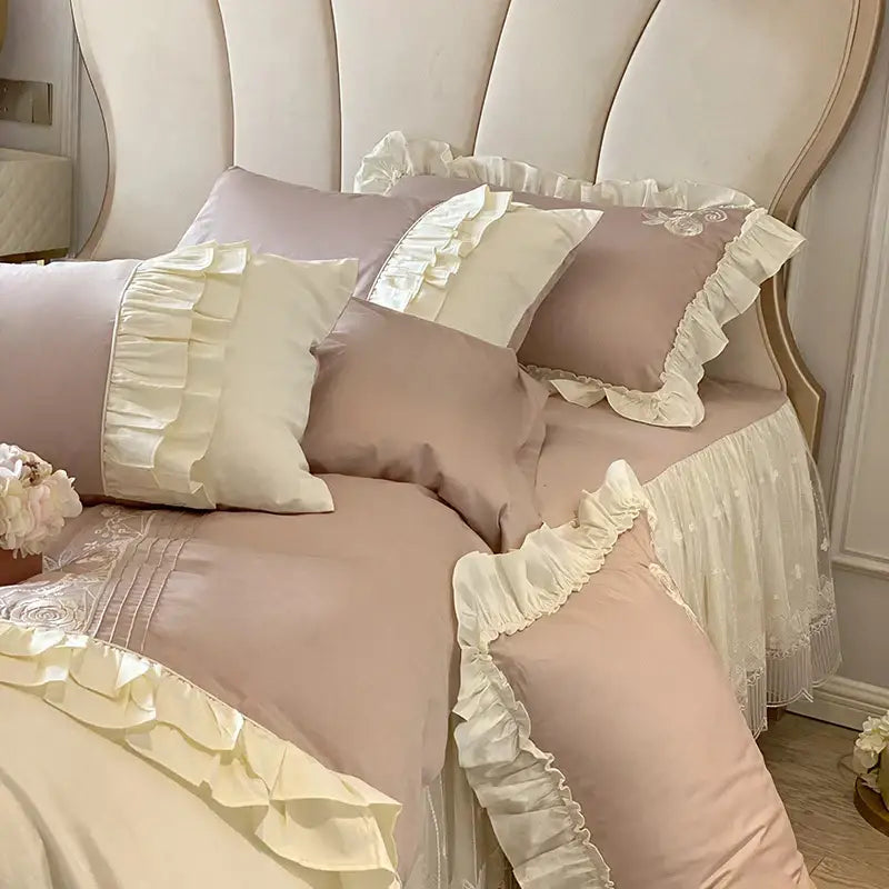 Vintage french bedding set featuring pastel pink and cream ruffles with delicate lace trim for bedroom decor