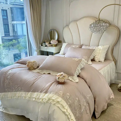 Beige satin duvet cover with vintage french ruffles and embroidered floral patterns in a bedding set