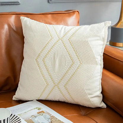 Cream-colored cushion cover with intricate soft gold geometric ivory vintage embroidery for living room decorbites