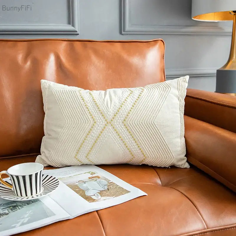 Cream-colored cushion cover with subtle gold thread embroidery creating geometric ivory vintage patterns by decorbites