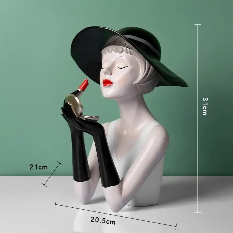 A glossy white resin vintage glamour bust wearing a black hat and gloves holding red lipstick for living room decorbites elegant decor