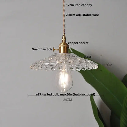Clear glass copper led pendant lamp with textured scalloped canopy and brass finished metal components for kitchen use