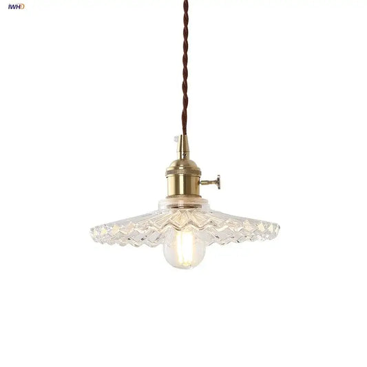 Vintage glass copper led pendant lamp with brass metal fixture and faceted glass shade hanging from twisted cord