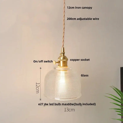 A warm-glowing glass copper led pendant lamp with a textured dome and brass-finished hardware for kitchen use