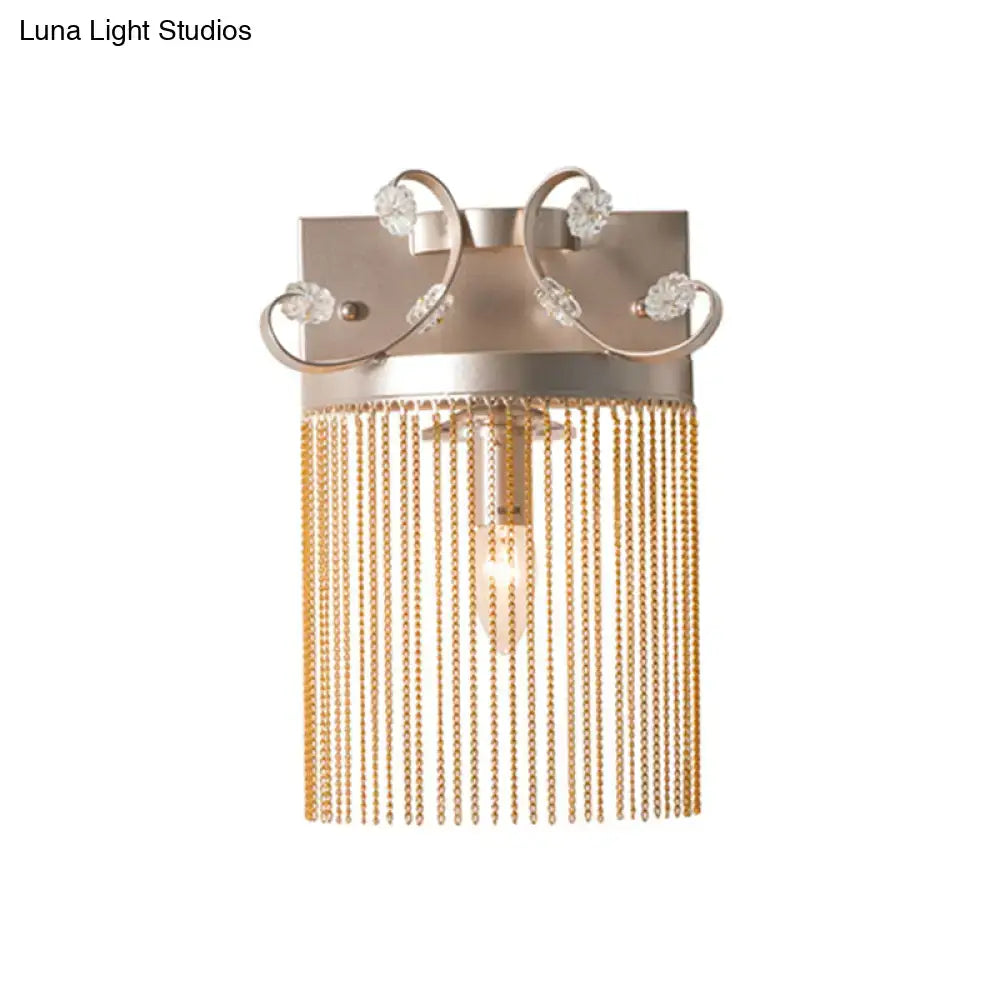 Vintage gold aluminum tassel wall light with rectangular backplate crystal accents and cascading gold chains wall light fixture