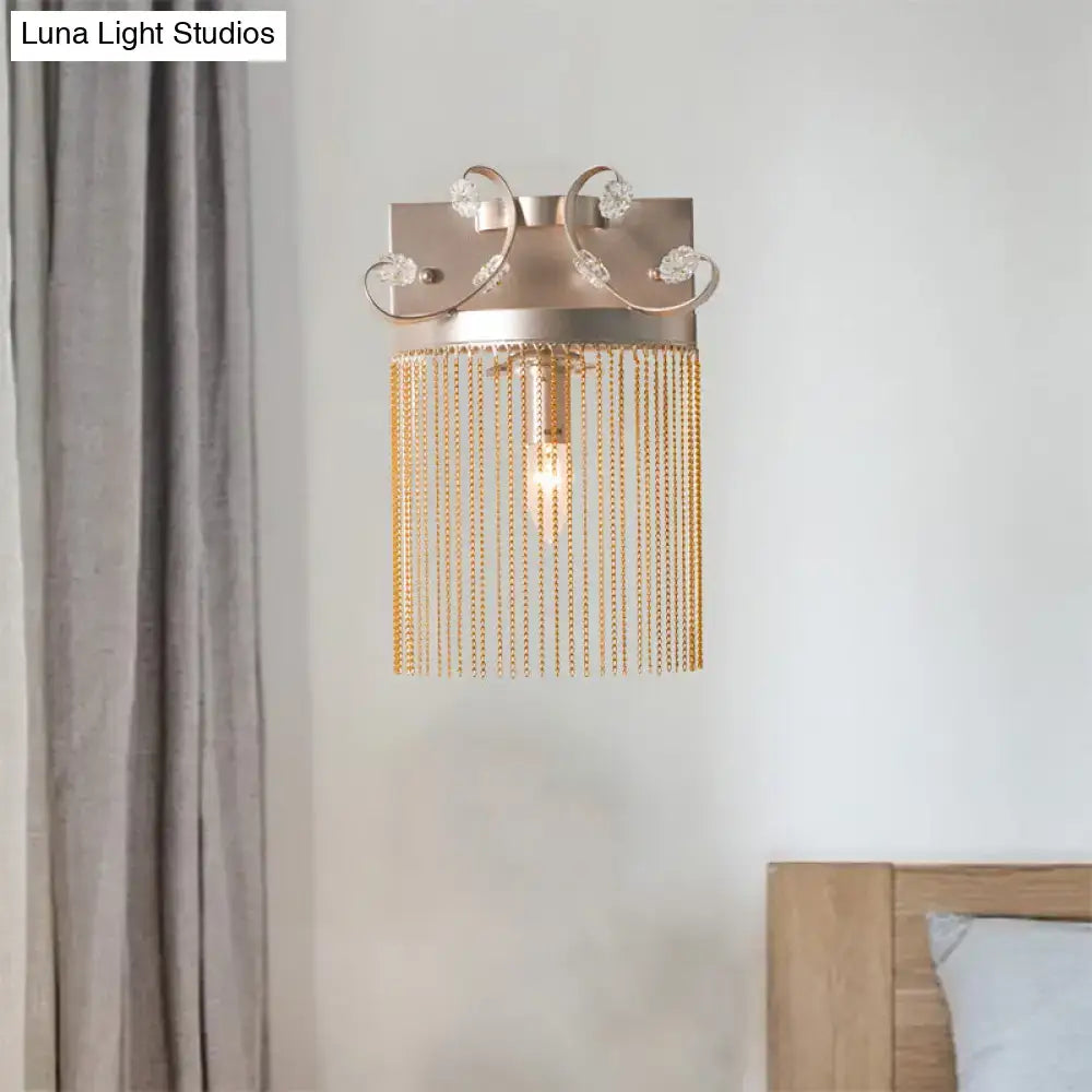 Vintage gold aluminum tassel wall light with crystal accents and cascading chains for elegant bedroom wall light fixture