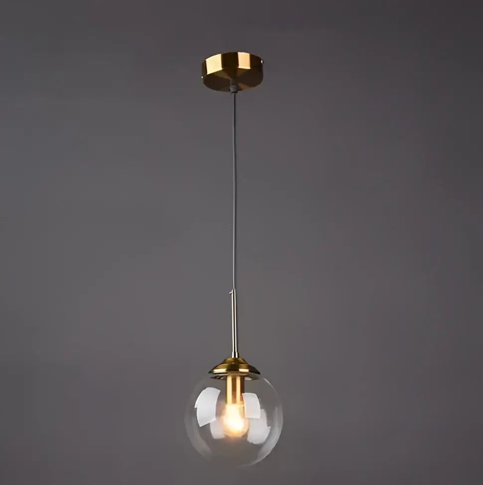 A sleek vintage gold amber glass bubble chandelier with clear glass globe and polished brass accents for living room decorbites glass bubble