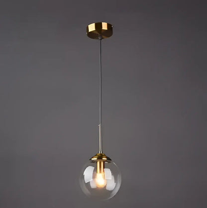 A sleek vintage gold amber glass bubble chandelier with clear glass globe and polished brass accents for living room decorbites glass bubble