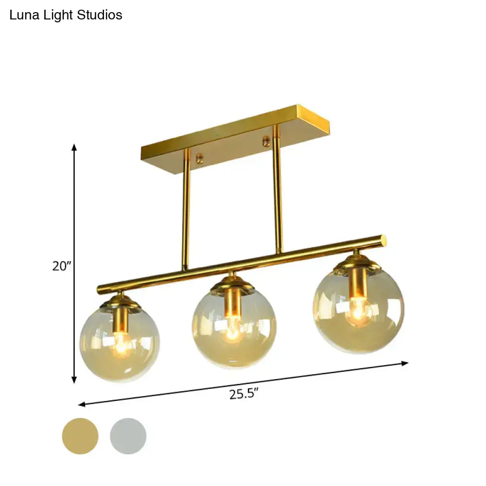 Gold finished DecorBites vintage 3-bulb pendant lamp with clear amber sphere glass bulbs for island lighting