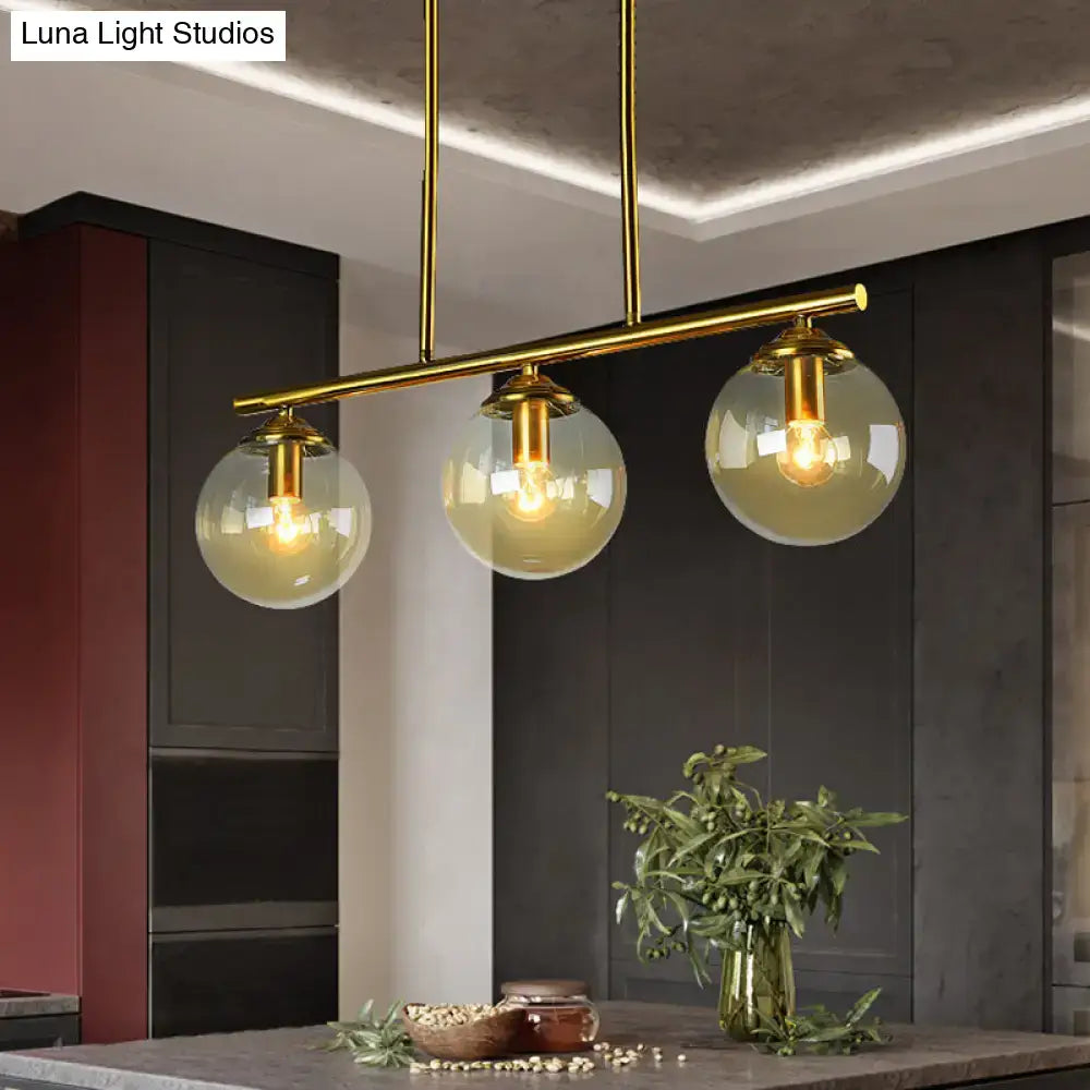 Gold-toned decorbites vintage 3-bulb pendant lamp with clear amber glass spheres and exposed filament bulbs for island lighting