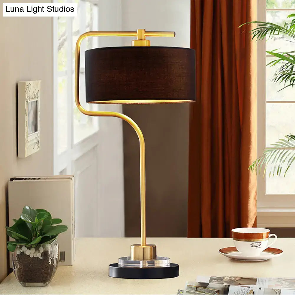 A decorbites vintage black table lamp with gold finish, drum shade, and modern curved base for living room 220v-240v