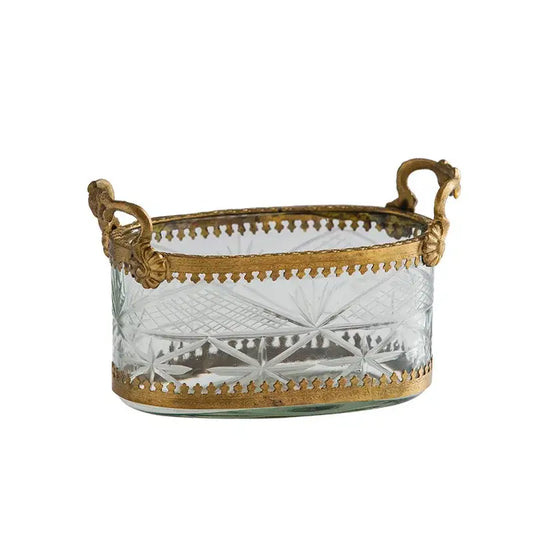 Vintage gold storage box featuring a clear cut carved glass oval basket with gold toned metal handles and decorative borders