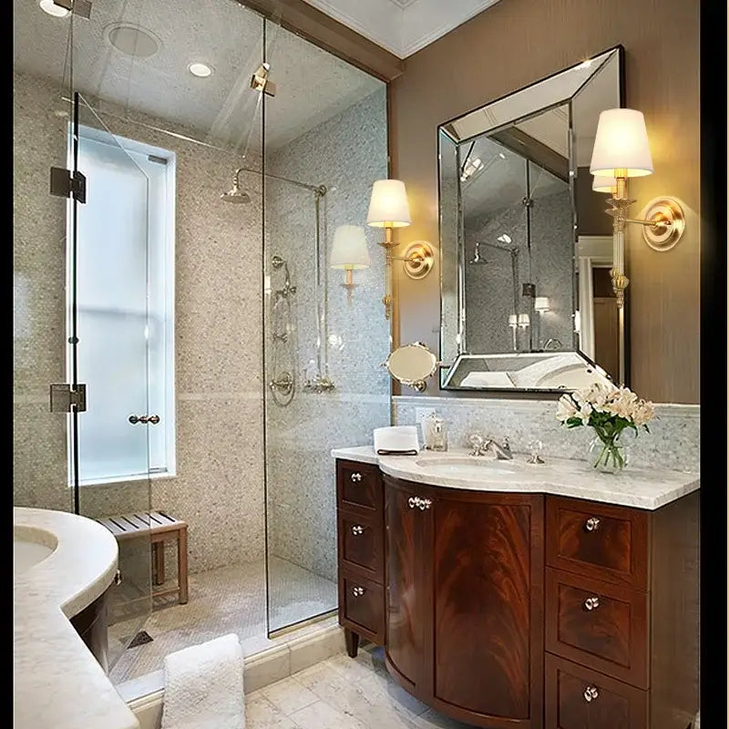 Dark wood vanity with marble countertop and silver hardware paired with vintage gold and cream led wall sconce decorbites copper vintage