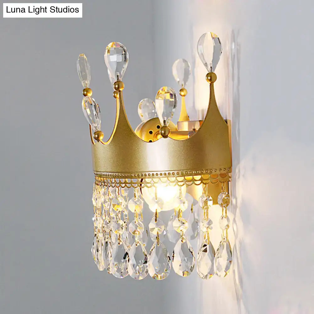 Vintage gold crown wall lamp adorned with clear crystal teardrops and faceted glass accents for bedroom sconce