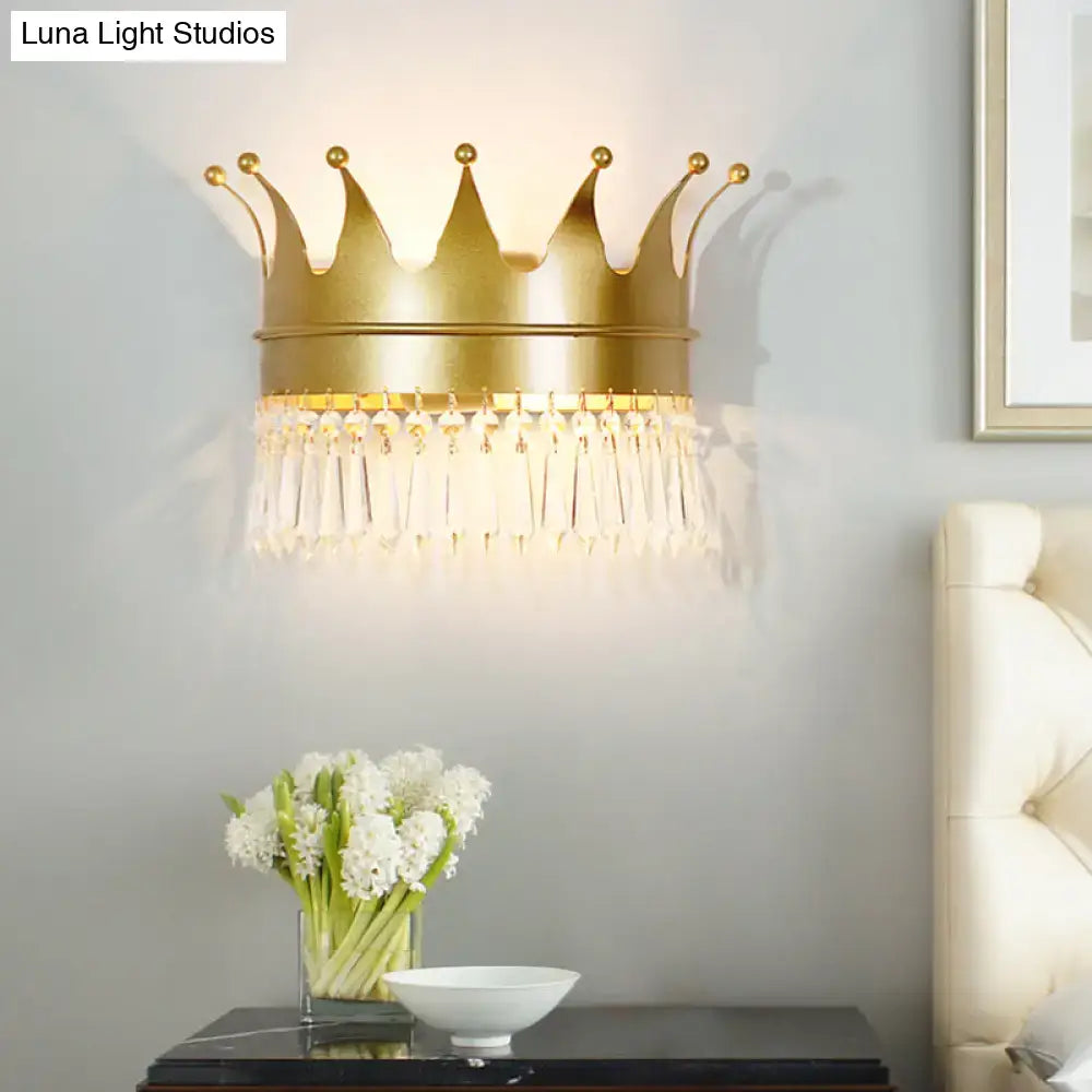 Vintage gold crown wall lamp featuring clear crystal tassels designed as a bedroom sconce for elegant lighting