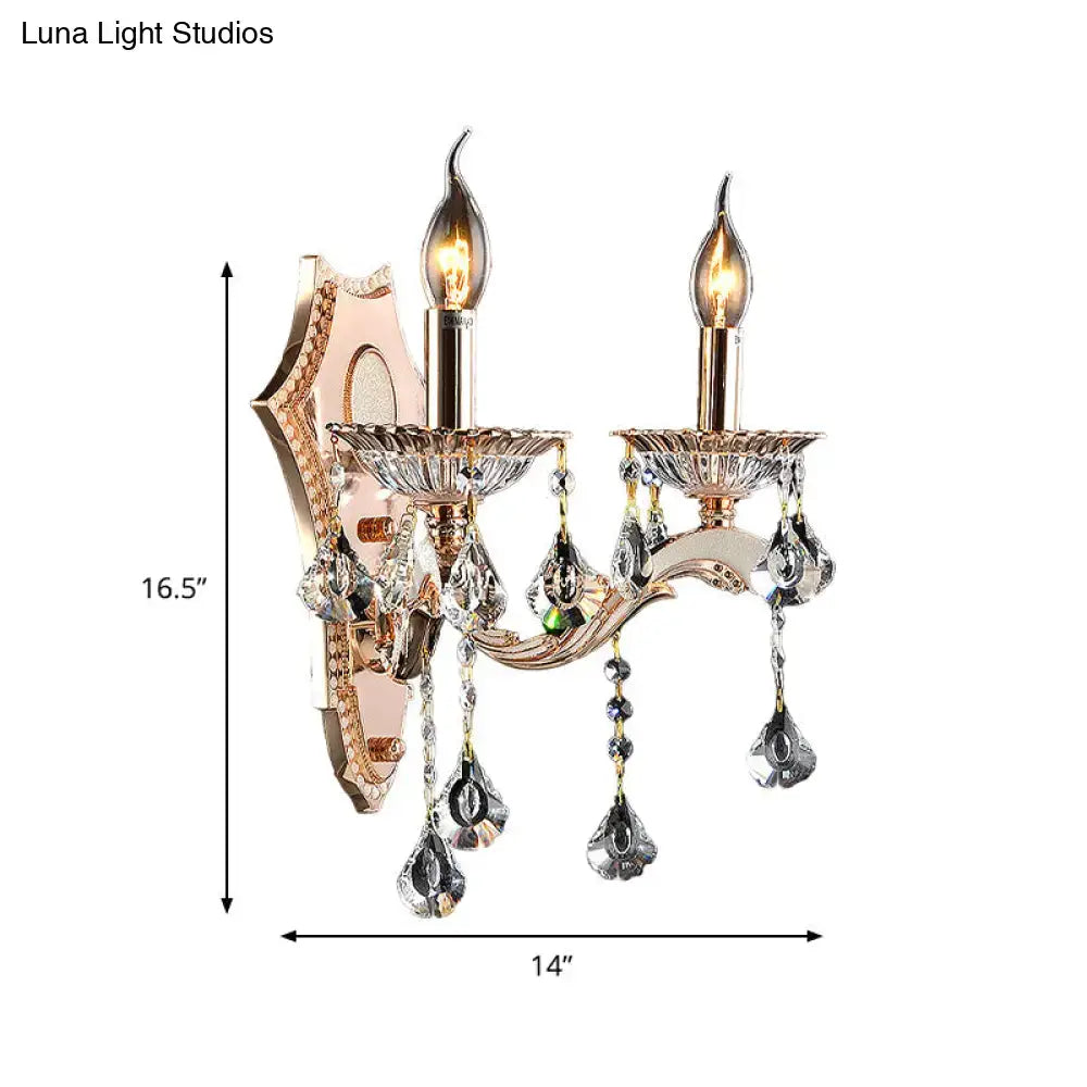 Rose gold two-light crystal sconce light fixture with dangling teardrop crystals direct wired electric bedroom mount