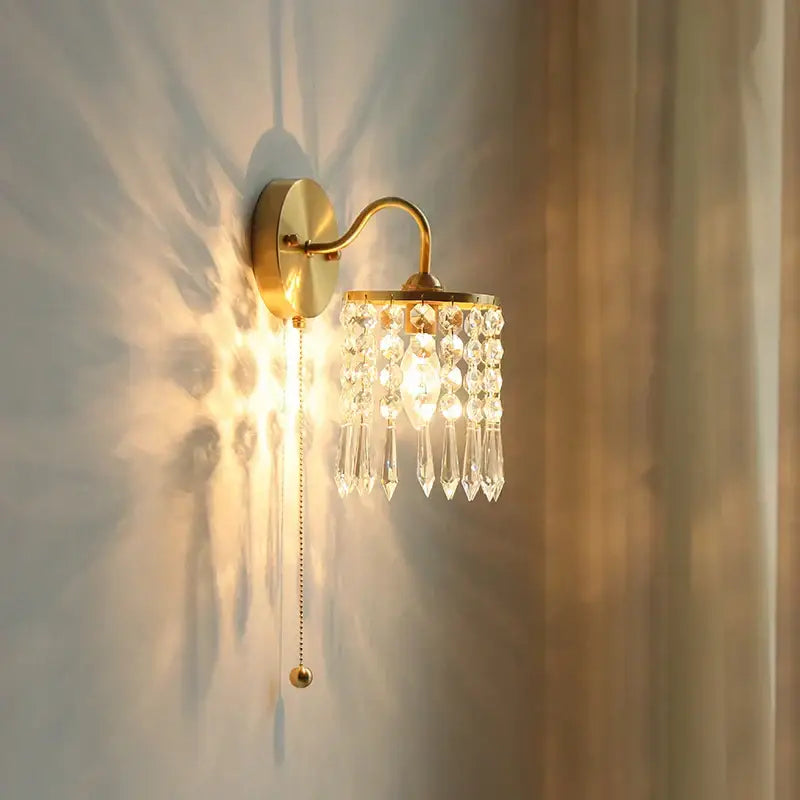 Gold-toned vintage gold crystal wall light sconce with cascading clear crystal droplets and pull chain switch decorbites crystal vintage