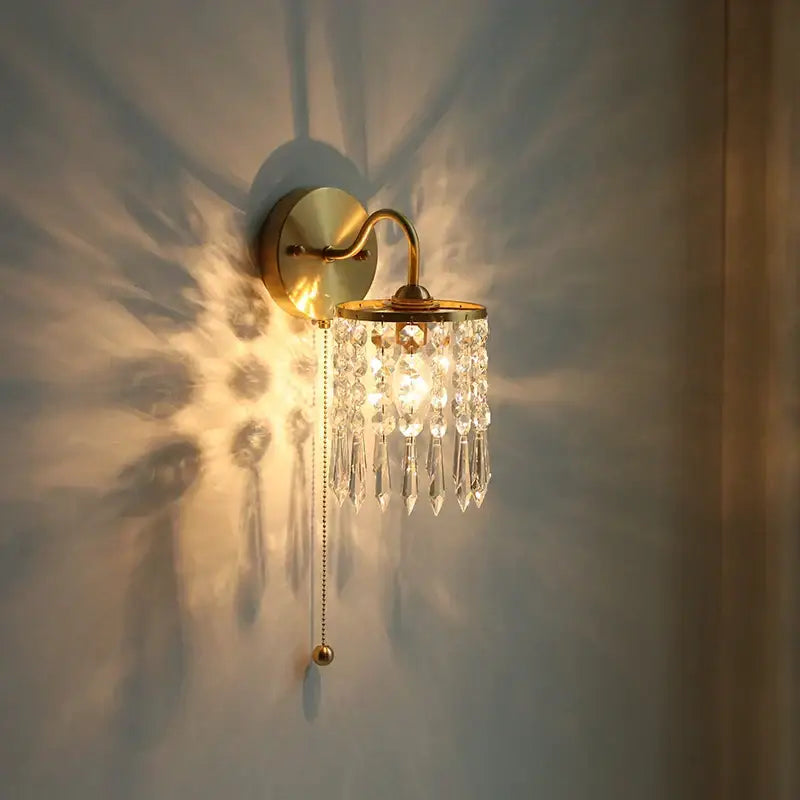 A vintage gold crystal wall light brass sconce with dangling crystal droplets and a pull chain switch decorbites crystal vintage