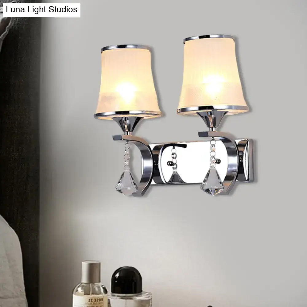 Chrome finished wall lamp with two frosted beige lampshades and crystal teardrop pendants for elegant bedroom lighting