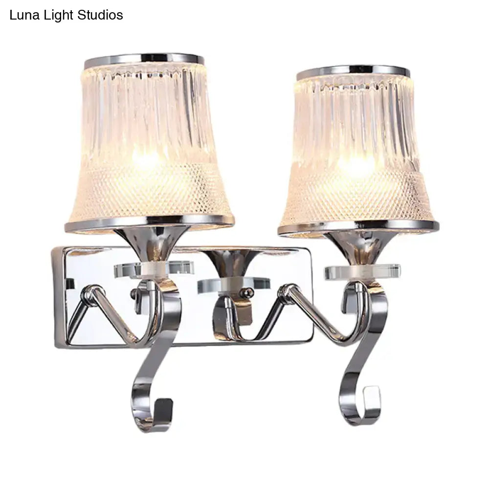Chrome-finished double-arm wall lamp with textured ribbed clear glass shades and vintage gold finish for bedroom use