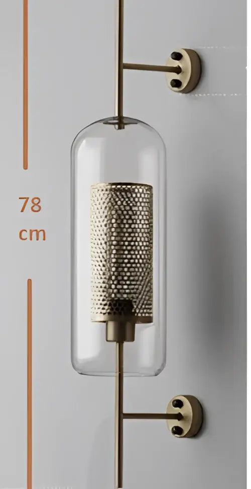A vintage gold mesh led wall sconce with a brass finish and clear glass cylinder for bedroom decorbites led wall lighting