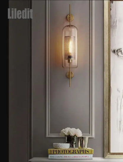 Vintage gold mesh led wall sconce with cylindrical glass shade and perforated metal mesh for bedroom decorbites led wall light fixture