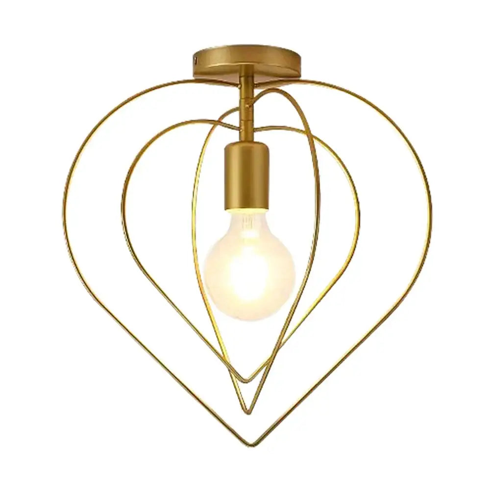 Vintage gold metal cage pendant light featuring a gold-toned heart-shaped ceiling light fixture with a visible bulb