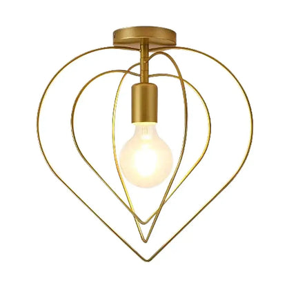 Vintage gold metal cage pendant light featuring a gold-toned heart-shaped ceiling light fixture with a visible bulb