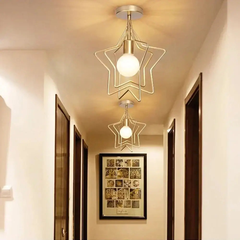 Vintage gold metal cage pendant light featuring a gold-toned star-shaped ceiling fixture with frosted glass bulb decorbites gold metal