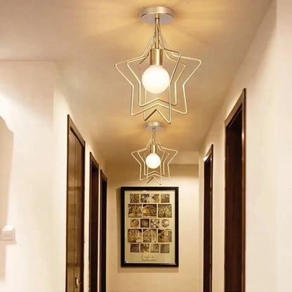 Vintage gold metal cage pendant light featuring a gold-toned star-shaped ceiling fixture with frosted glass bulb decorbites gold metal