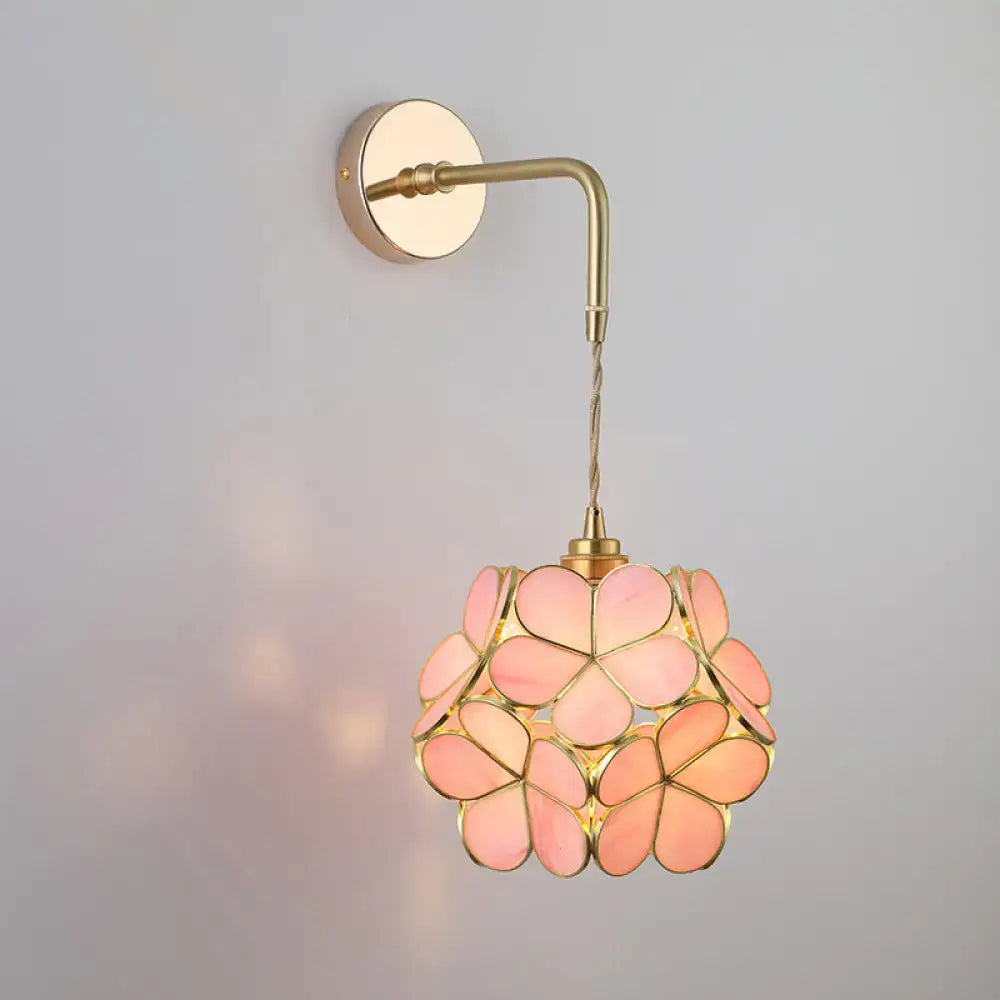 Decorbites vintage single-bulb bedside wall light in gold with delicate pink shaded glass wall light and brass hardware