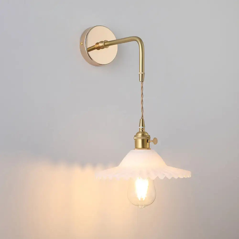 DecorBites vintage single-bulb wall light in brass finish with scalloped off-white shaded glass wall light fixture