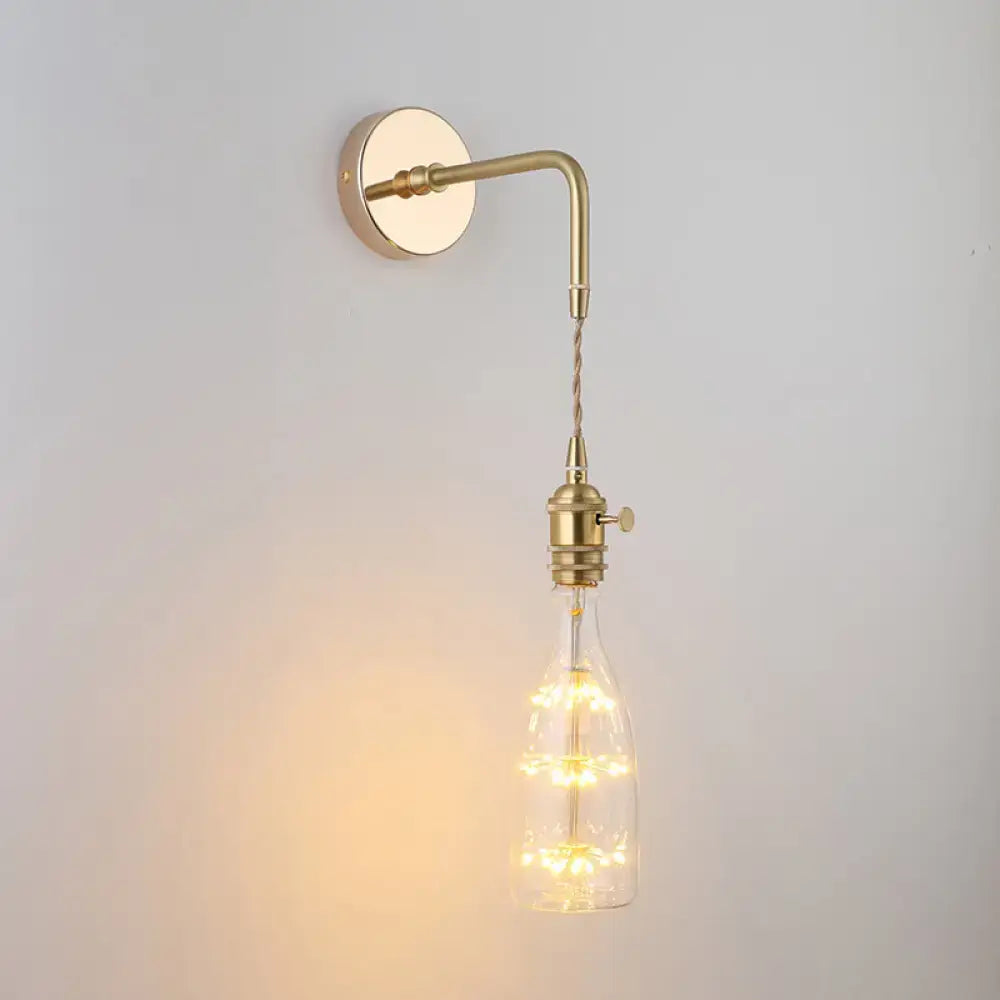 Decorbites vintage single-bulb bedside wall light in brass finish with clear shaded glass wall and warm led lights