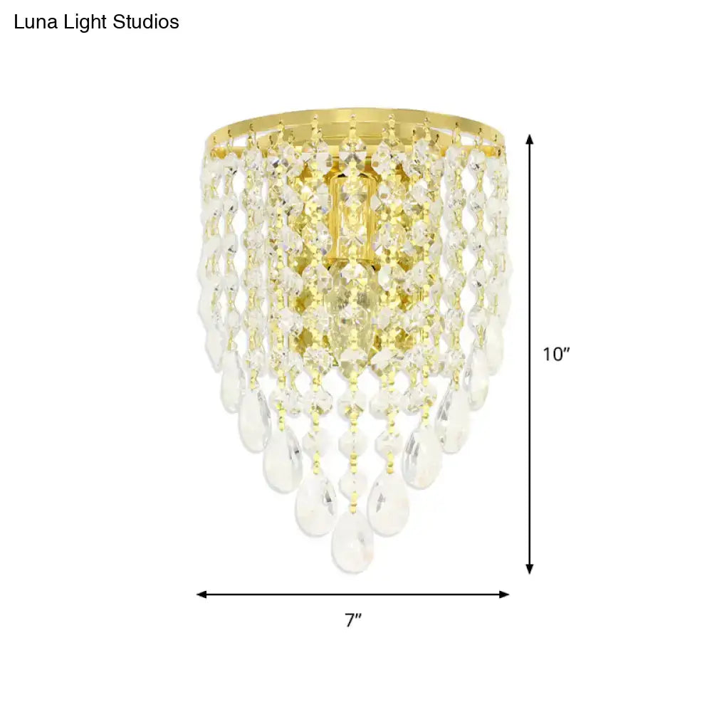 Vintage gold tapered wall mount bedroom light with clear crystal draping and a 10 inch gold-toned crystal chandelier