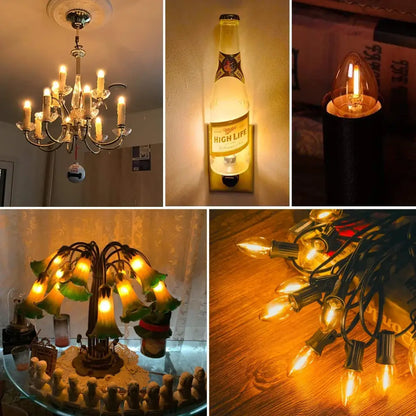 A vintage-style chandelier with ornate metal arms and lit decorbites gold tint glass led candelabra bulbs