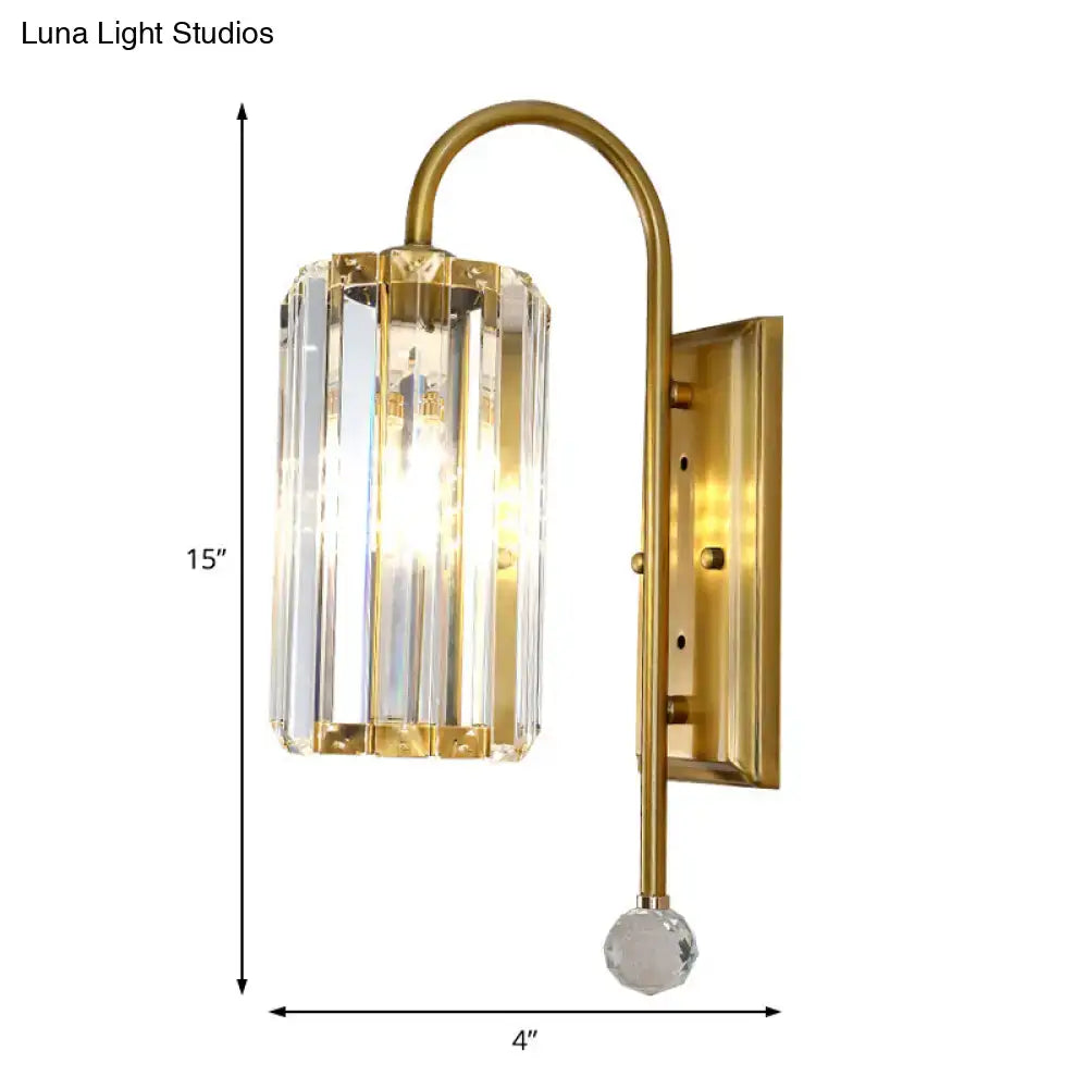 Vintage gold wall light with a clear crystal shade featuring vertical prisms and a faceted glass globe base for bedroom use