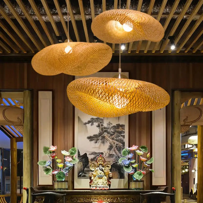 Three warm-toned vintage golden bamboo weave led pendant lights for dining room in modern rustic style