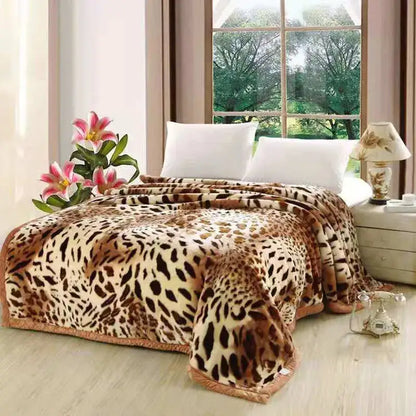 A plush double layered raschel blanket with leopard print cream and brown soft fleece vintage bedroom throw