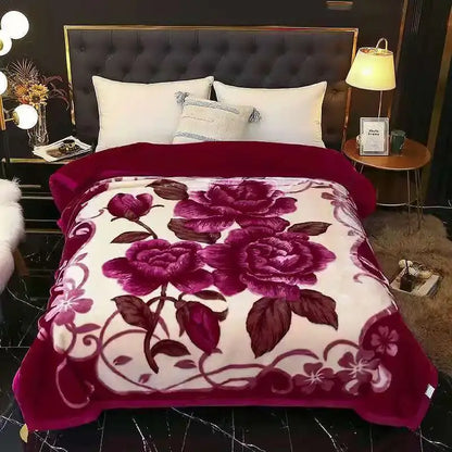 A cream-colored plush vintage gray double layered raschel blanket with a burgundy rose and vine pattern for bedroom use