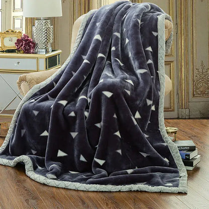 Dark gray double layered raschel blanket with white triangular patterns and light gray quilted border vintage style