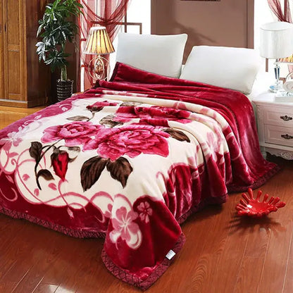 A plush red and cream floral embroidered rose double layered raschel blanket vintage for bedroom use