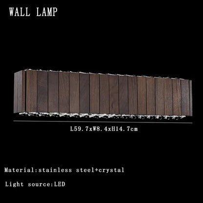 Modern rectangular wall lamp with dark wood grain and crystal accents next to vintage gray glass large ceiling pendant light