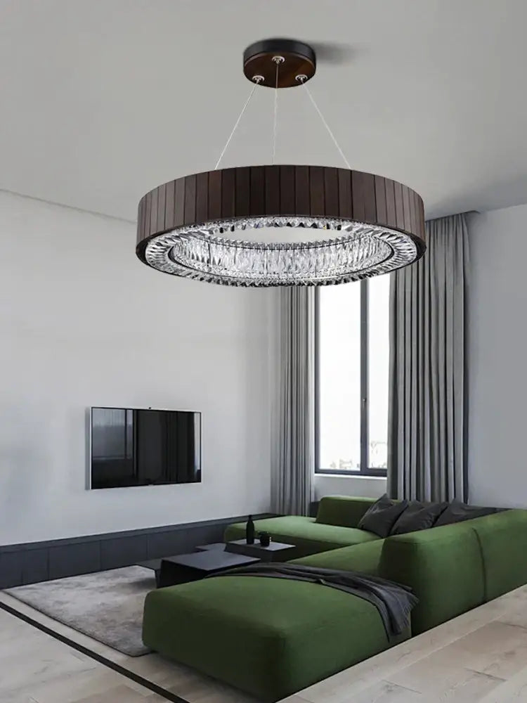 A modern pendant light with a dark wood frame and clear crystal elements for vintage gray glass large ceiling use
