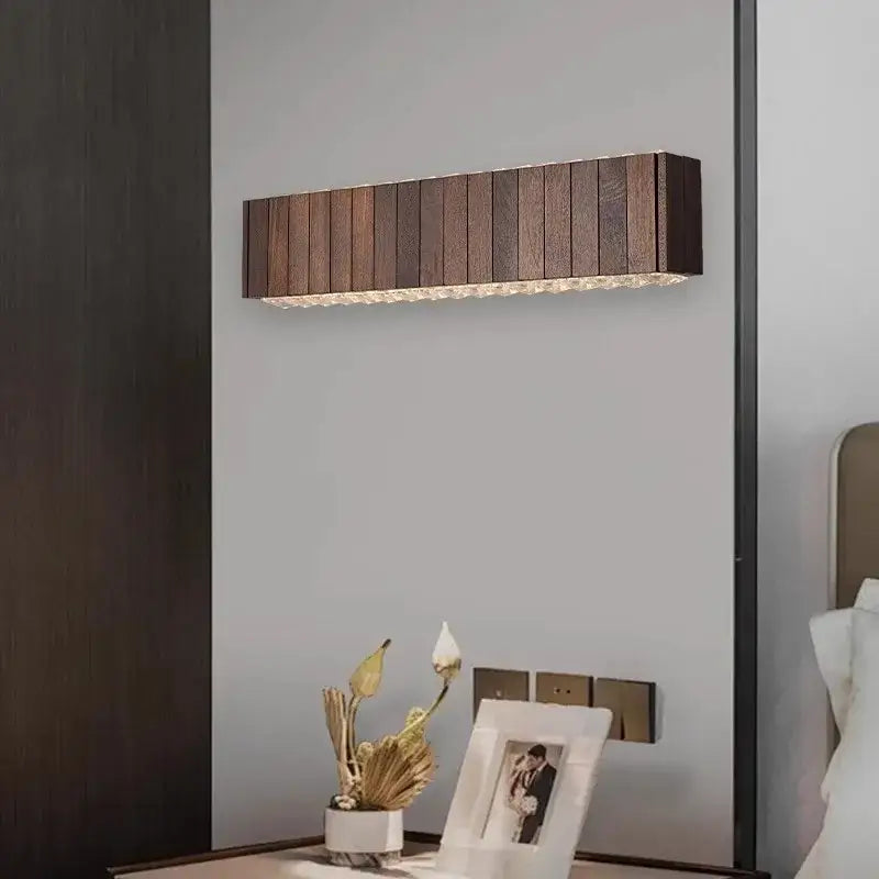 Vintage gray glass large ceiling pendant light with dark wood slat wall sconce and glowing textured light strip