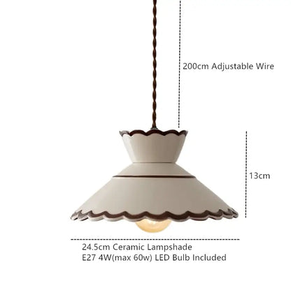 Cream-colored ceramic pendant light with scalloped edge and dark trim featuring 200cm adjustable twisted wire suspension