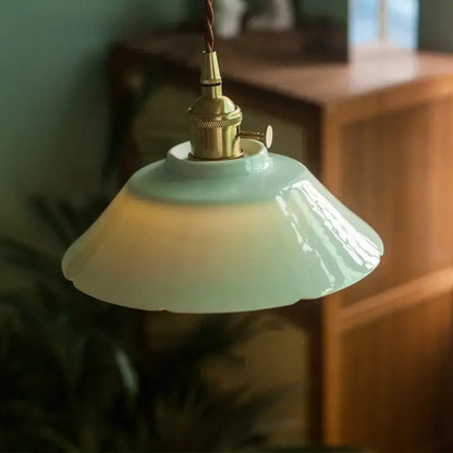 Delicate mint-green vintage green ceramic pendant light with brass-finished socket for kitchen hanging lamp