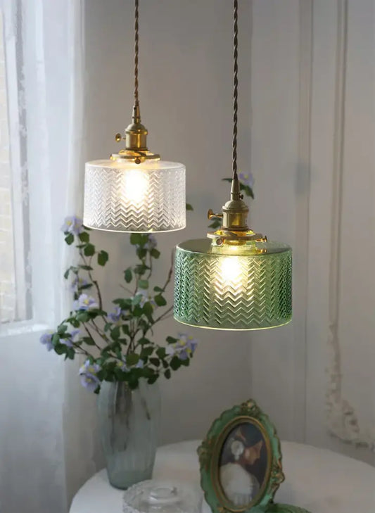 Two vintage glass shade chandelier pendant lights with embossed chevron pattern in clear and green for dining room use