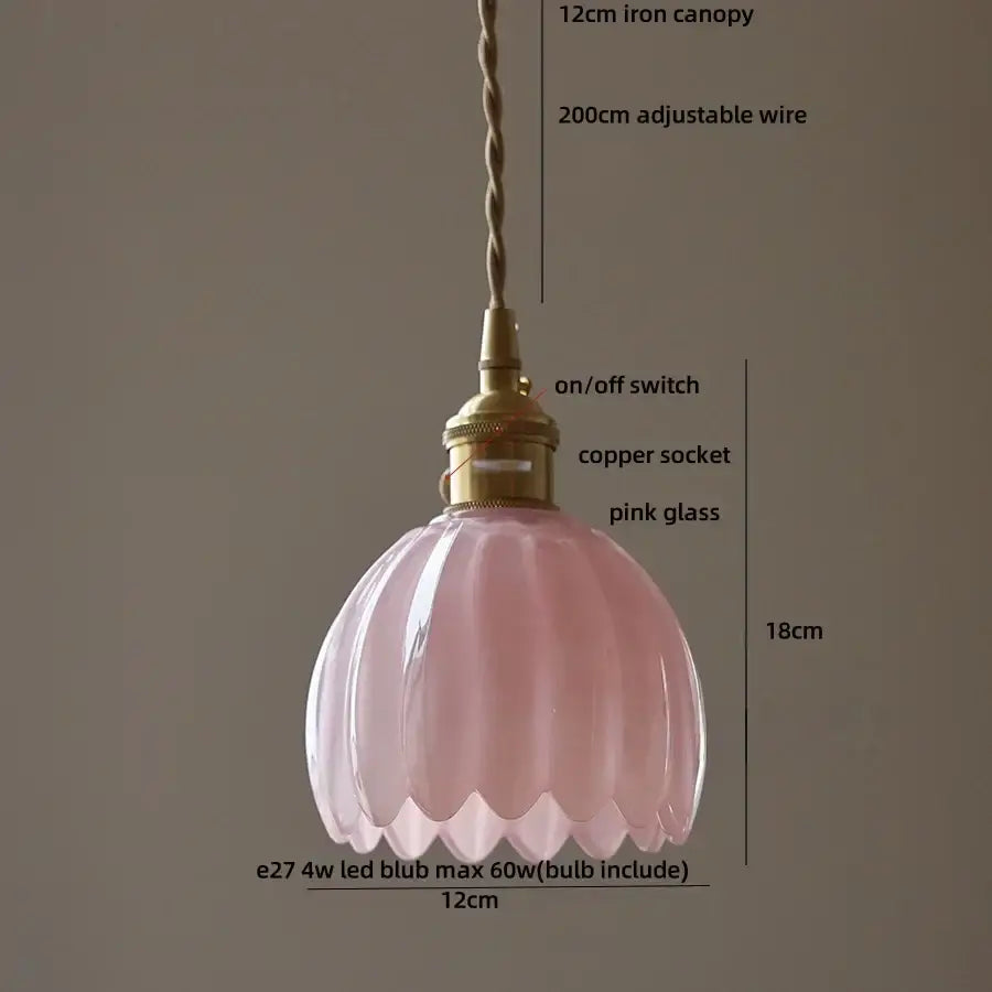 A delicate pink glass pendant light with fluted design and brass fittings for vintage green led pendant kitchen use