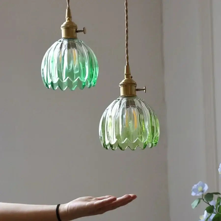 Two vintage green glass led pendant lights with brass fixtures and twisted cords for kitchen use pendant light