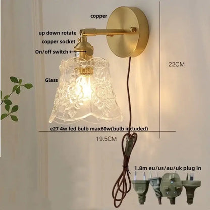 Antique brass-finished wall light with clear etched glass shade featuring floral patterns in vintage green glass led style